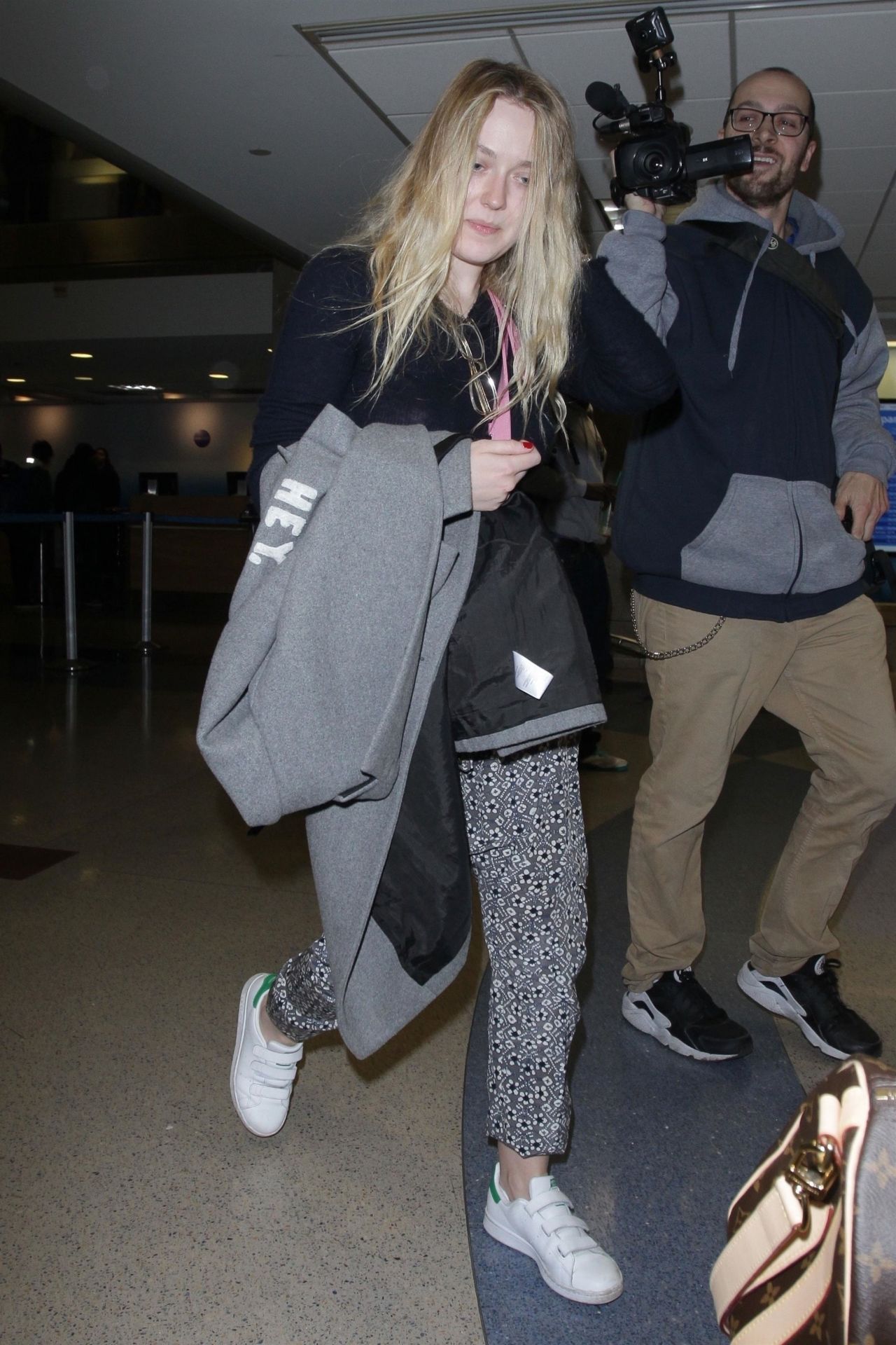 dakota-fanning-at-lax-airport-12-19-2017-0.jpg