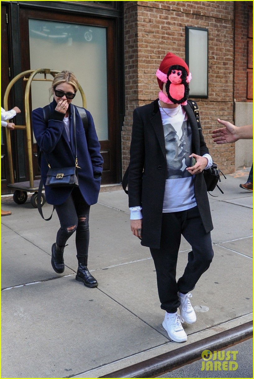 cara-delevingne-makes-ashley-benson-laugh-while-stepping-out-with-stuffed-monkey-on-her-face01.jpg